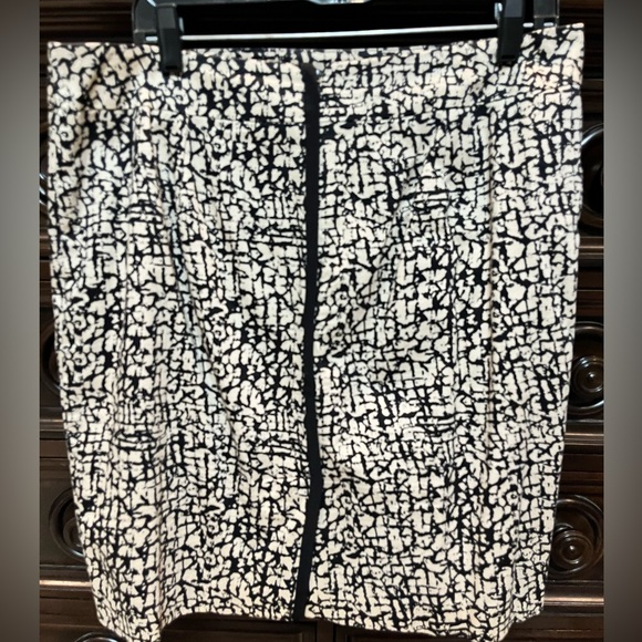 Lined skirt. Tan/Khaki with Black design. Back zipper. Back slit. - Picture 2 of 6